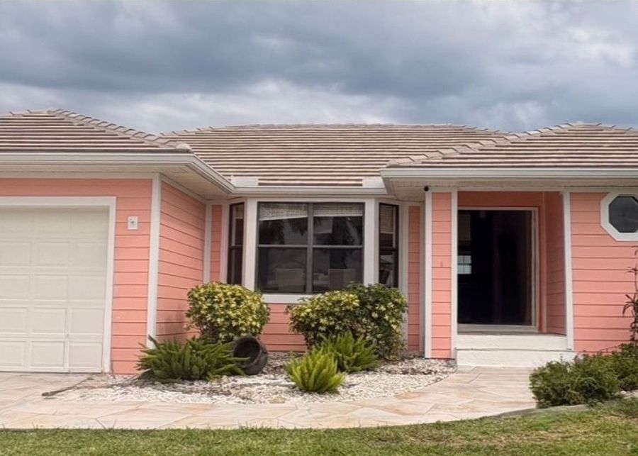 Coral exterior repaint with white trim