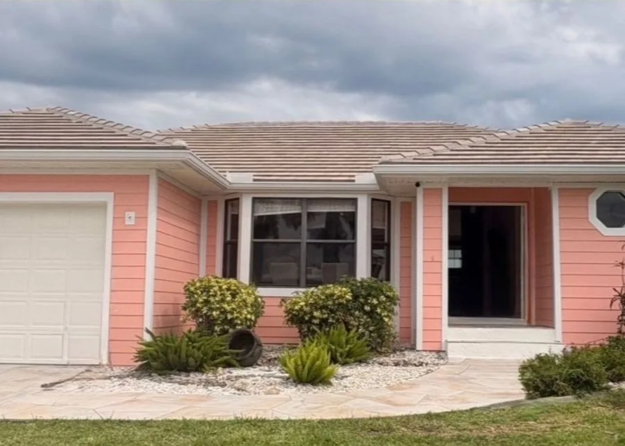Coral exterior repaint with white trim