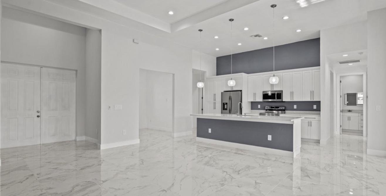 Great room with polished marble-look tile flooring