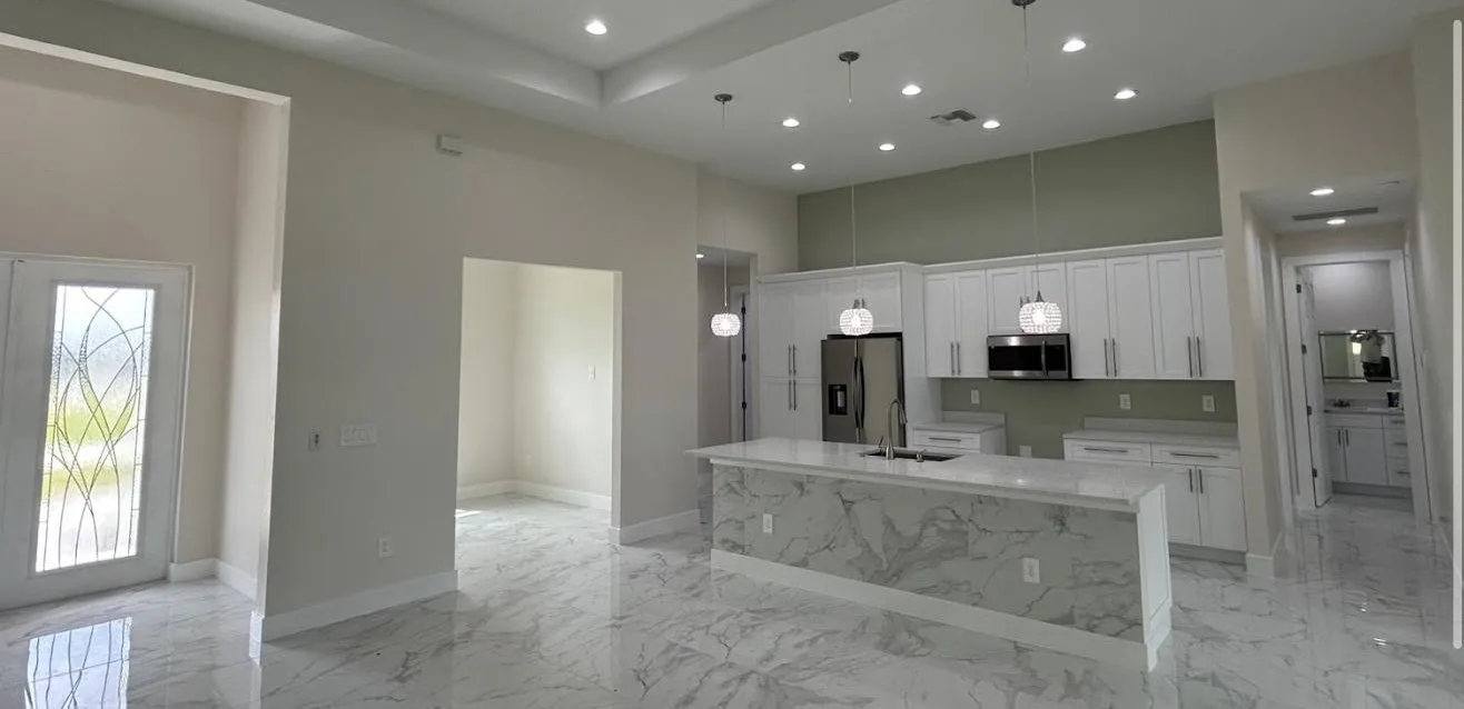Great room and kitchen showing tile flooring, painted walls and ceiling working together