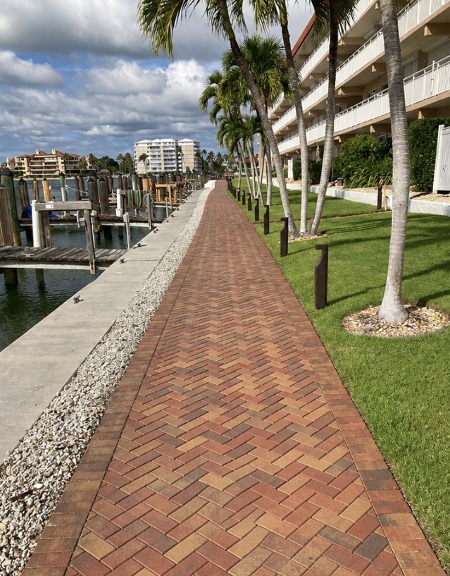 Home with clean sealed pool deck and pavers