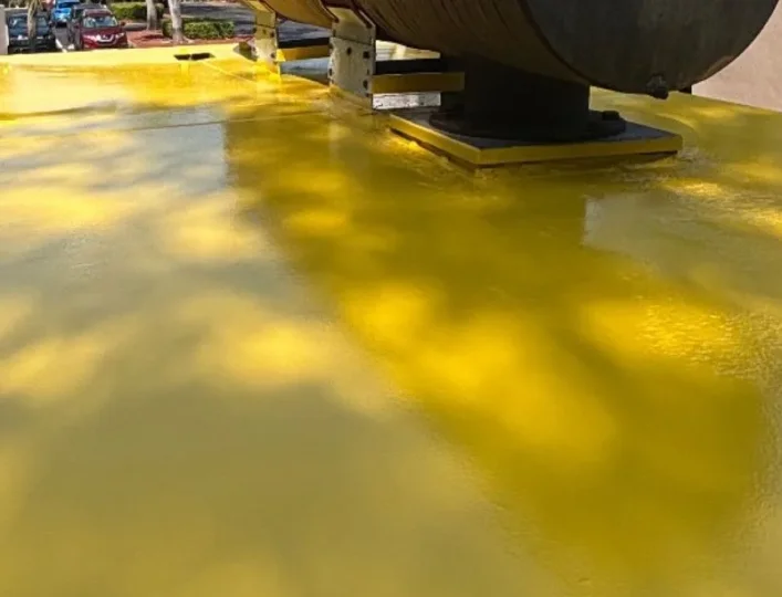 High-gloss protective coating on an industrial tank